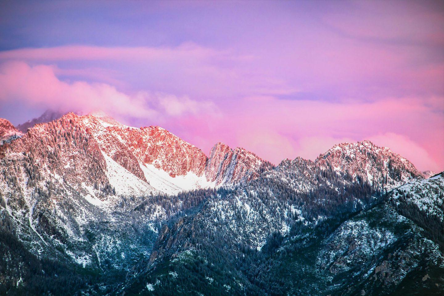 Rocky Mountain sunset pink clouds over snowy rugged peaks